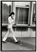 https://ed-templeton.com/files/gimgs/th-156_Boy walking Smoking white suit Antwerp.jpg